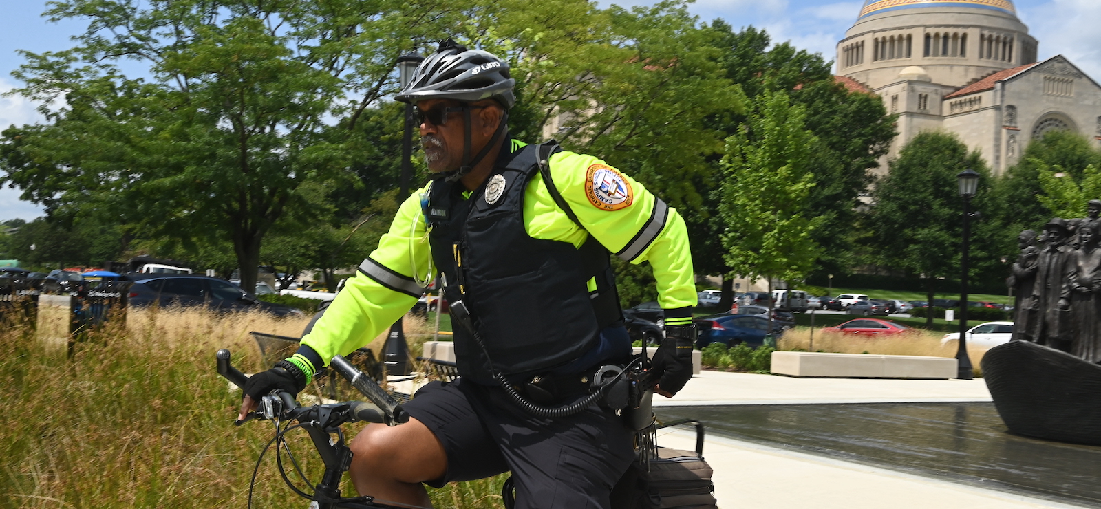 Public Safety officer patrolling campus by bike